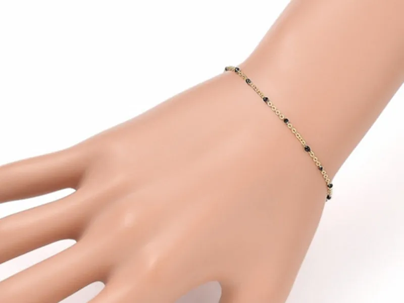 La Petite Epicerie Armband emaille stippen zwart goud 18,5 cm